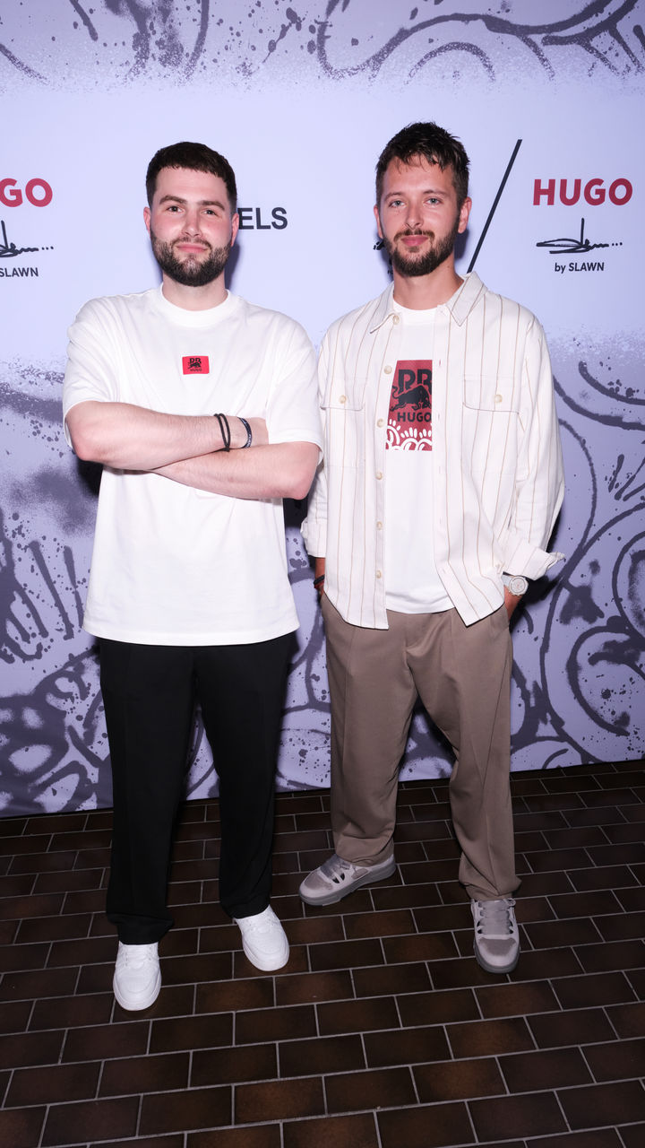 2025_HUGO_Flannels_Slawn_Car_Reveal_LogoWall_Jake_Boys_and_Fabio_Bocco_9x16_005.jpg